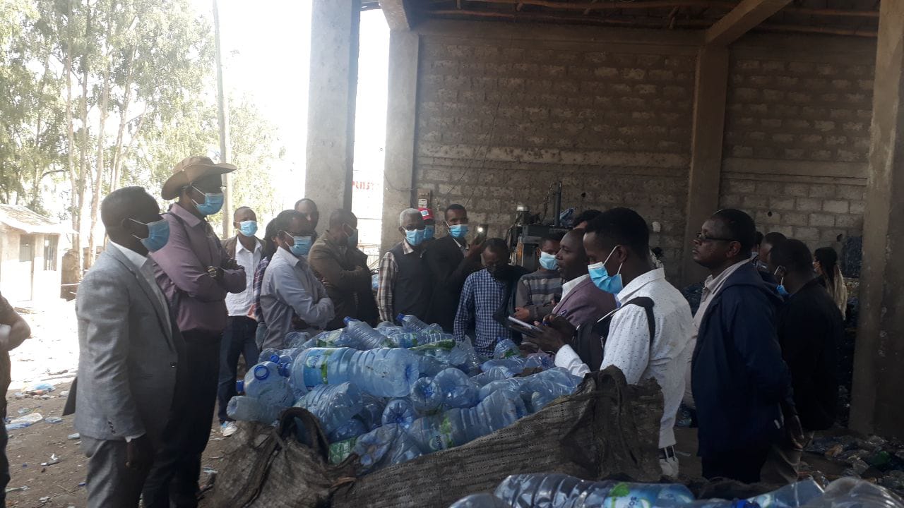 Inspecting collected plastic bottles